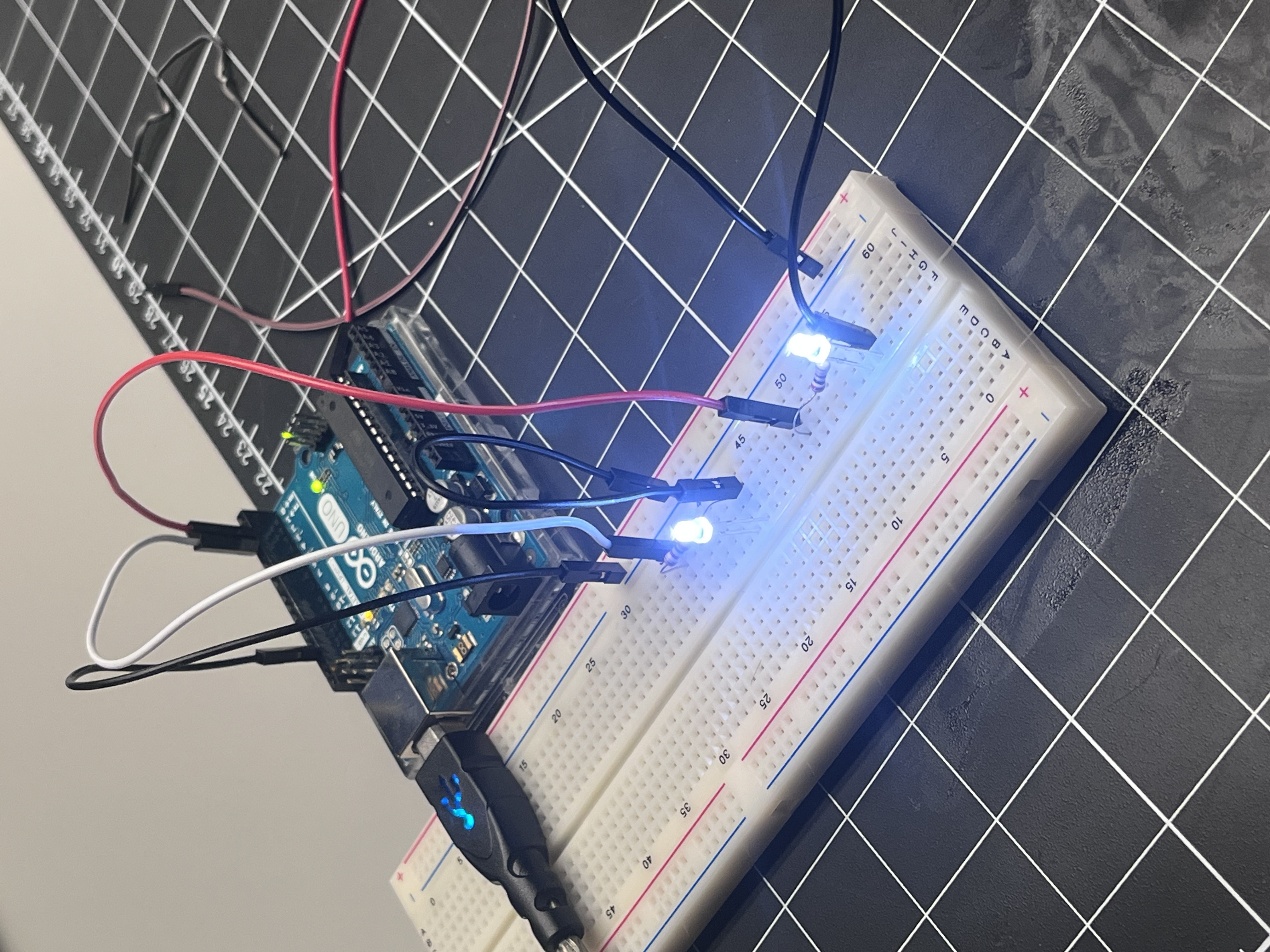 Two LEDs were added and connected to separate digital pins to visualize multi-output control.  Both LEDs blinked alternately based on the programmed sequence, simulating a simple light pattern.