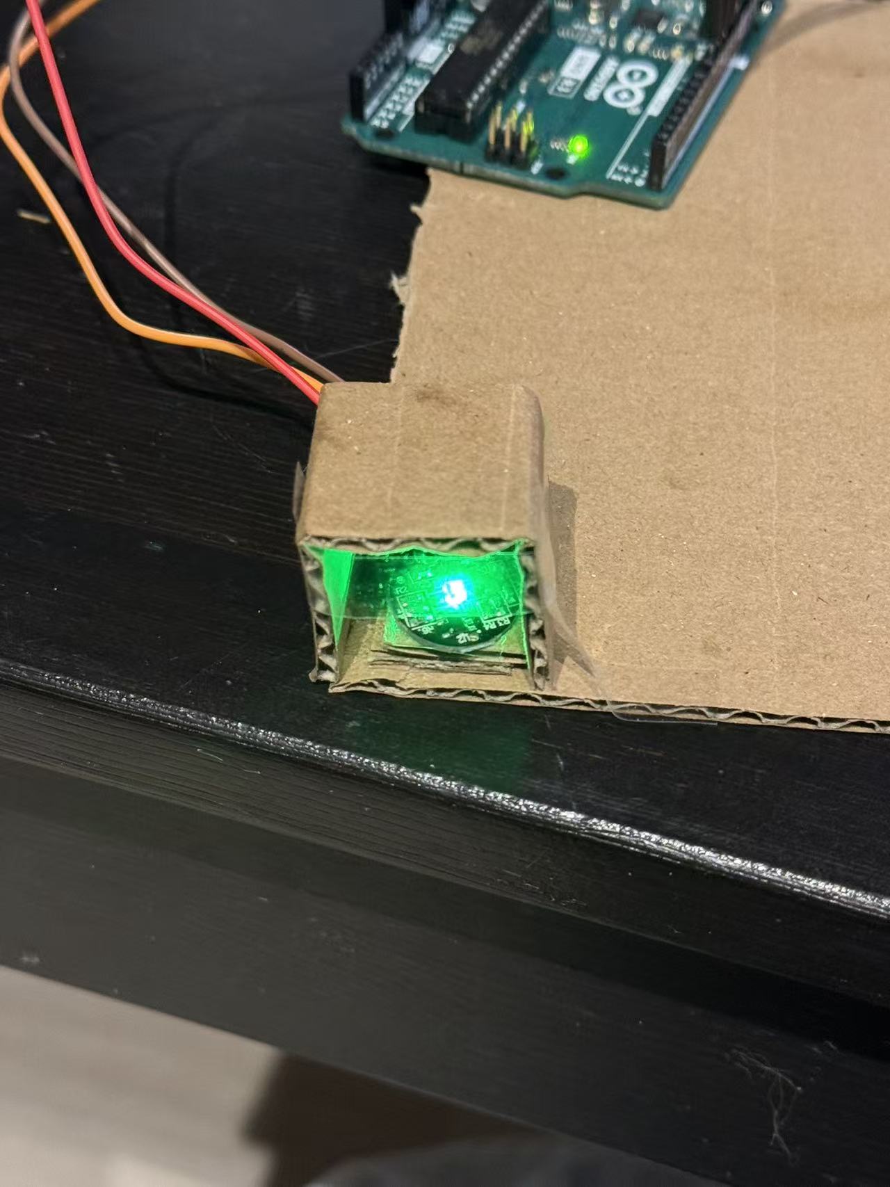 A small cardboard tunnel was created to diffuse the LED and observe light behaviour under different enclosures.